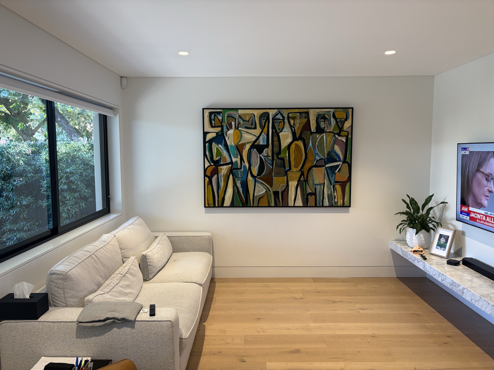 Large canvas hung in modern living room, Top Notch Handyman Service