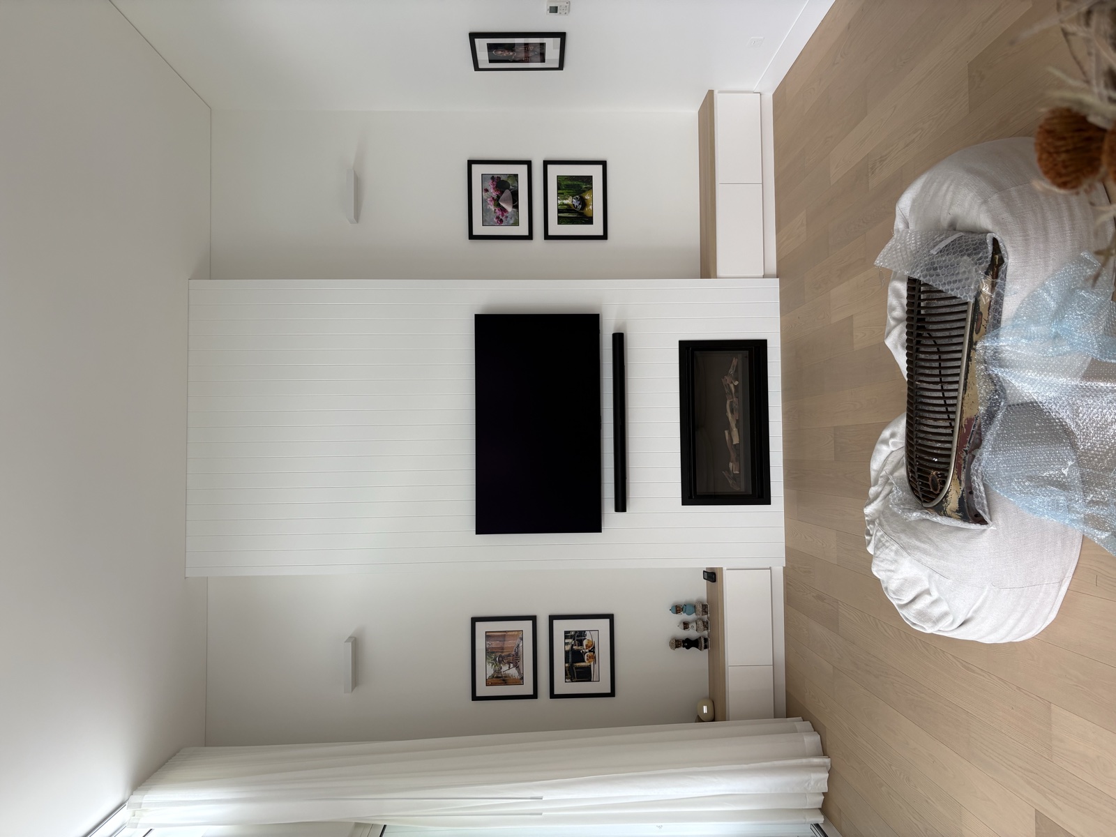TV mounted with framed pictures on feature wall, Top Notch Handyman Service