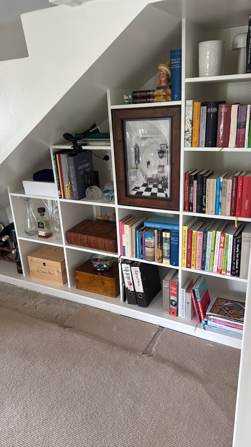 Custom built-in shelving under a staircase, Top Notch Handyman Service
