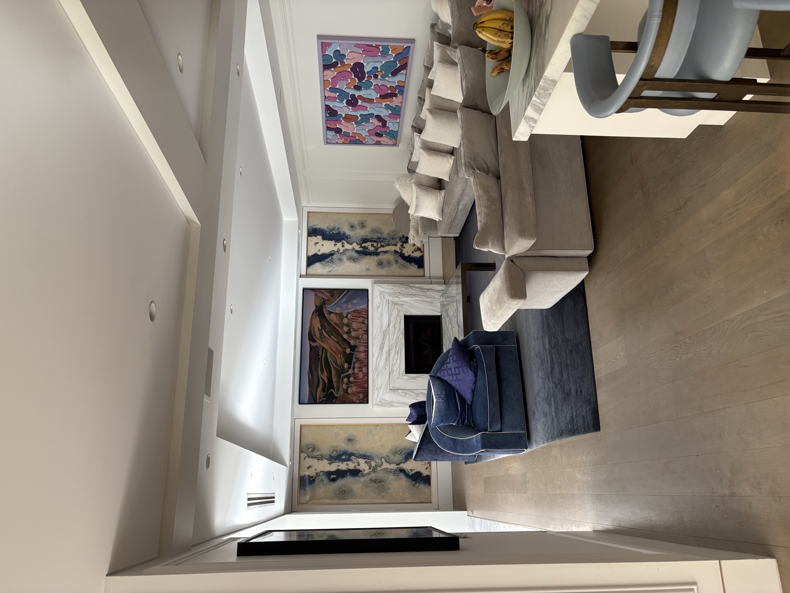 Multiple artworks hung in luxury living room, Top Notch Handyman Service