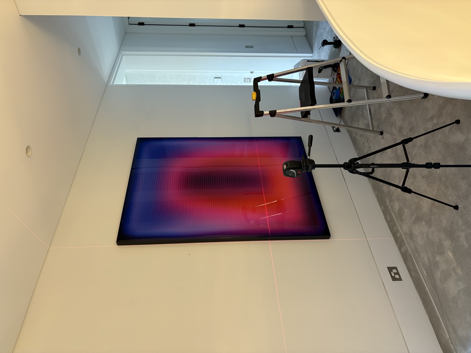 Large artwork hung using laser level, Top Notch Handyman Service