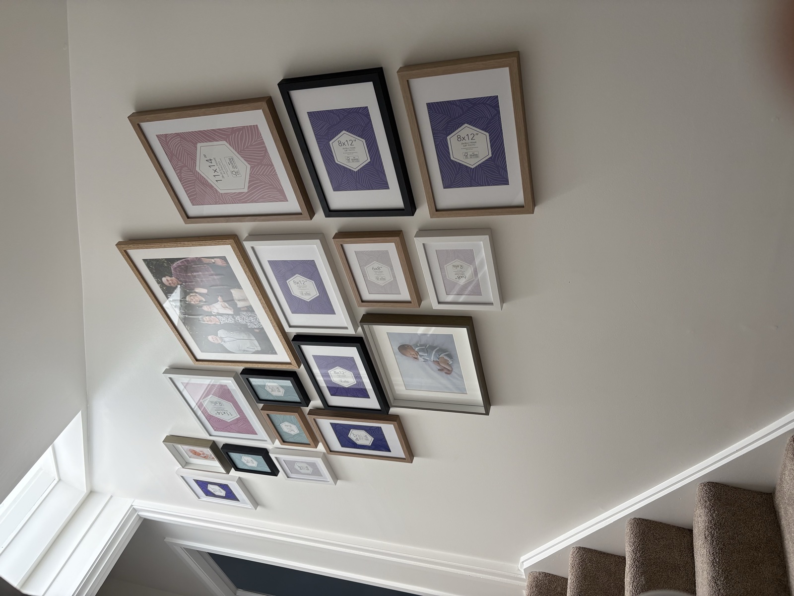 Gallery wall installation on staircase, Top Notch Handyman Service