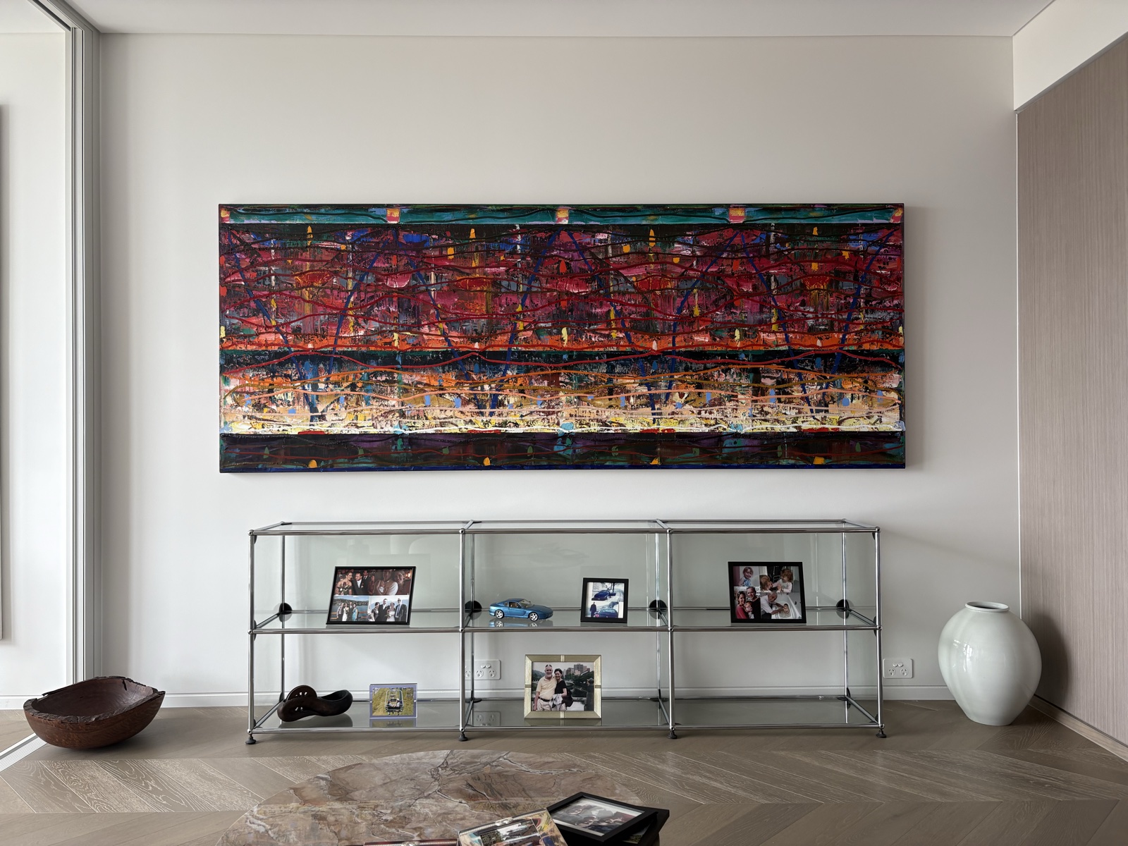 Large painting hung above display shelving, Top Notch Handyman Service